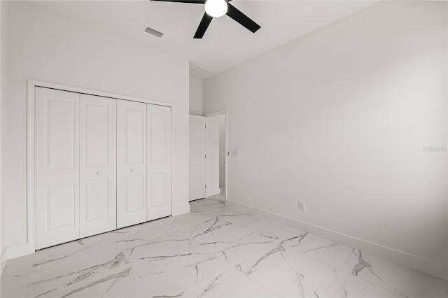 unfurnished bedroom featuring a closet and ceiling fan