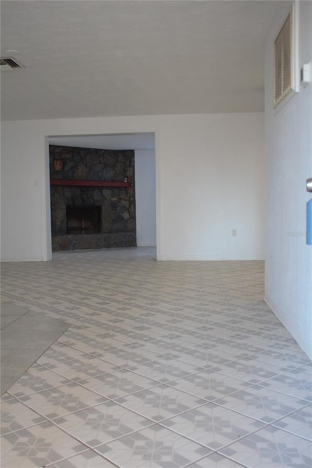 unfurnished living room with a fireplace