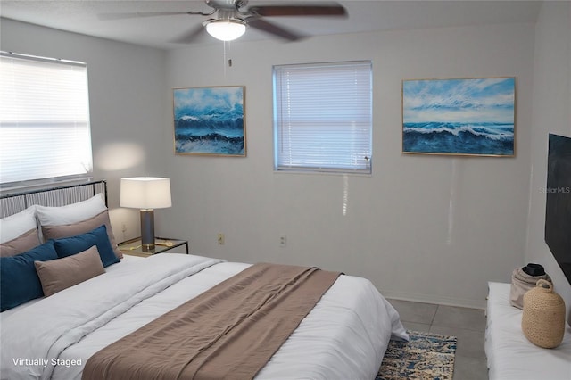 tiled bedroom with ceiling fan