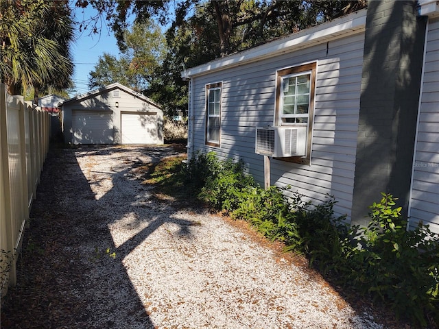 view of side of property with an outbuilding and a garage