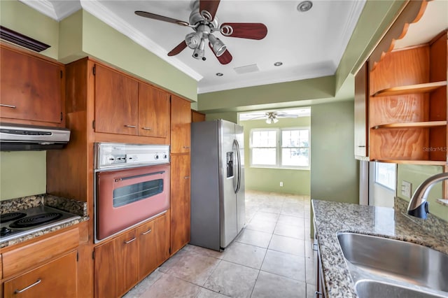 kitchen featuring light stone countertops, sink, appliances with stainless steel finishes, exhaust hood, and ornamental molding