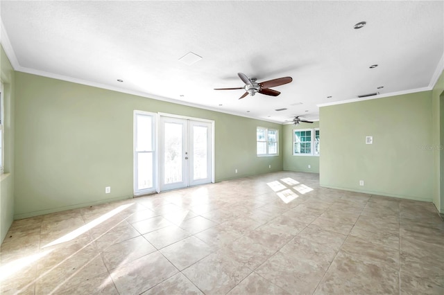 spare room featuring crown molding, french doors, ceiling fan, and a textured ceiling