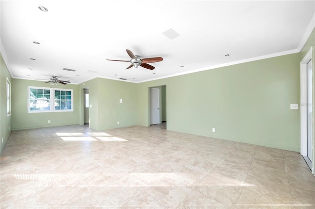 unfurnished room featuring ceiling fan and crown molding