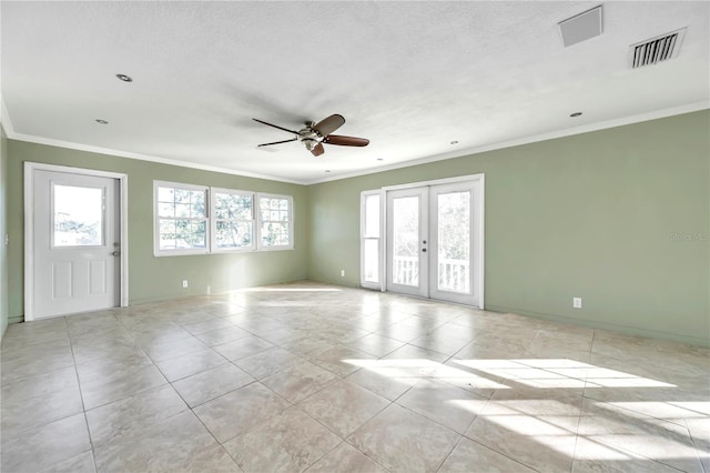 unfurnished room featuring a wealth of natural light, french doors, ceiling fan, and crown molding