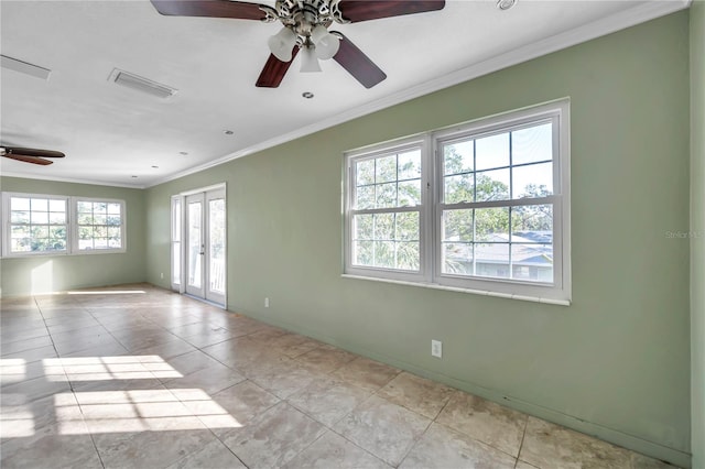 spare room with french doors, light tile patterned floors, ceiling fan, and crown molding