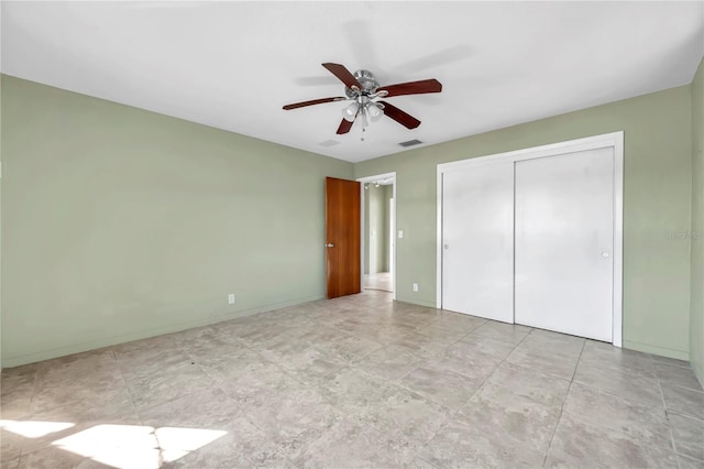 unfurnished bedroom featuring a closet and ceiling fan