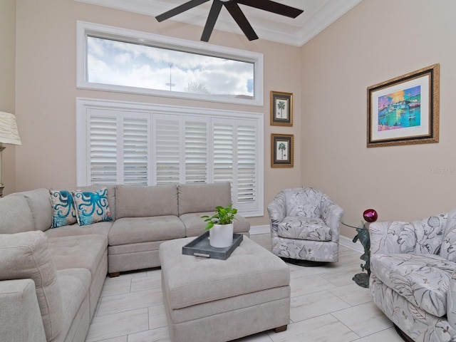 living room with a wealth of natural light, crown molding, and ceiling fan