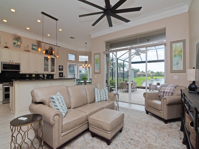 living room with ceiling fan with notable chandelier, light hardwood / wood-style floors, crown molding, and sink