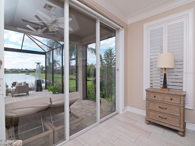 doorway to outside with a water view and crown molding