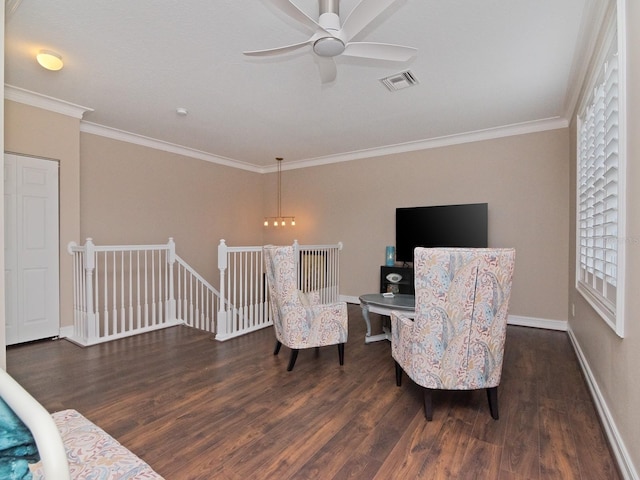 sitting room with ceiling fan, dark hardwood / wood-style floors, and ornamental molding