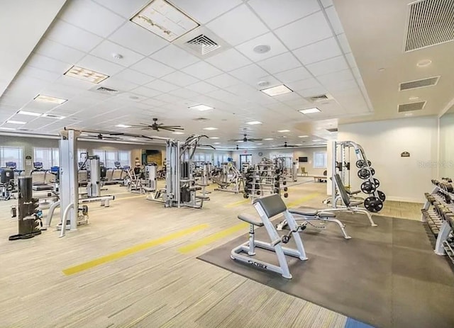 gym featuring a paneled ceiling