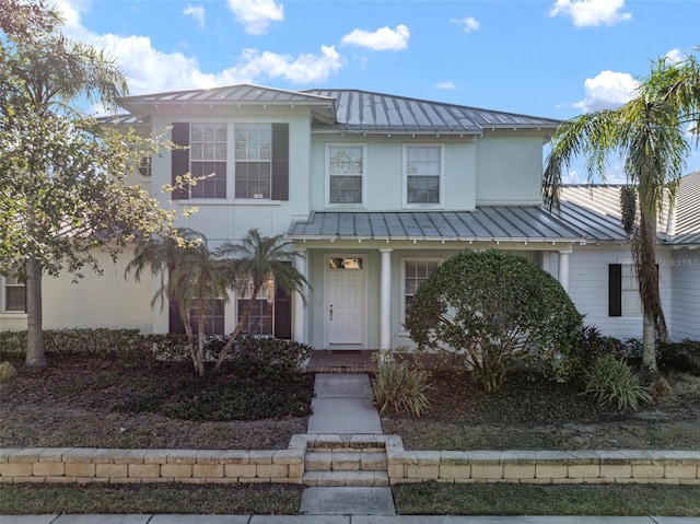 322 Ibisview Ln, Apollo Beach, FL 33572 - view of front of home with a standing seam roof and metal roof