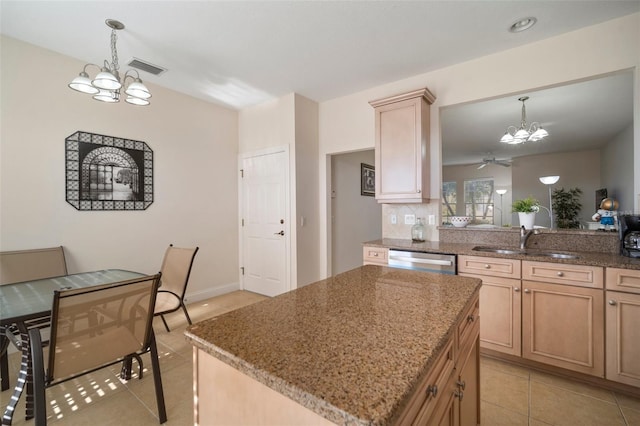 322 Ibisview Ln, Apollo Beach, FL 33572 - kitchen featuring a chandelier, a sink, dishwasher, light tile patterned flooring, and light brown cabinets