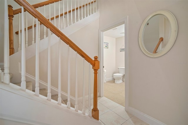 stairs with tile patterned flooring