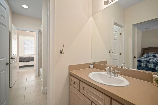 bathroom with tile patterned floors and vanity