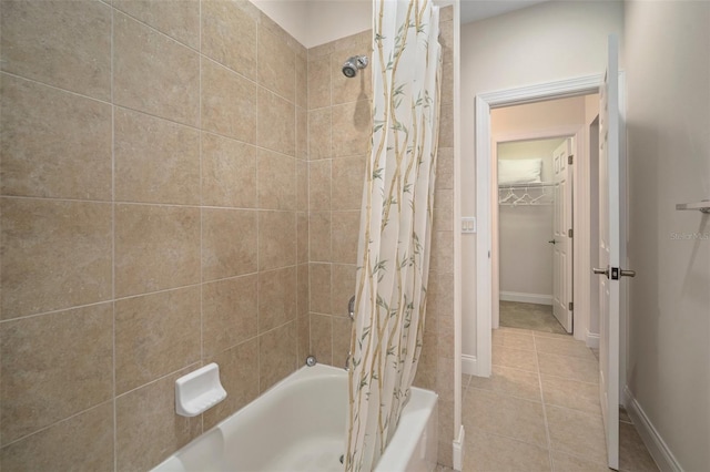 bathroom with tile patterned floors and shower / bath combination with curtain