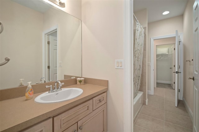 bathroom with tile patterned flooring, vanity, and shower / bathtub combination with curtain