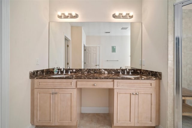 bathroom featuring vanity and a shower with door