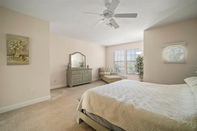 322 Ibisview Ln, Apollo Beach, FL 33572 - bedroom featuring light carpet, baseboards, a ceiling fan, and a textured ceiling