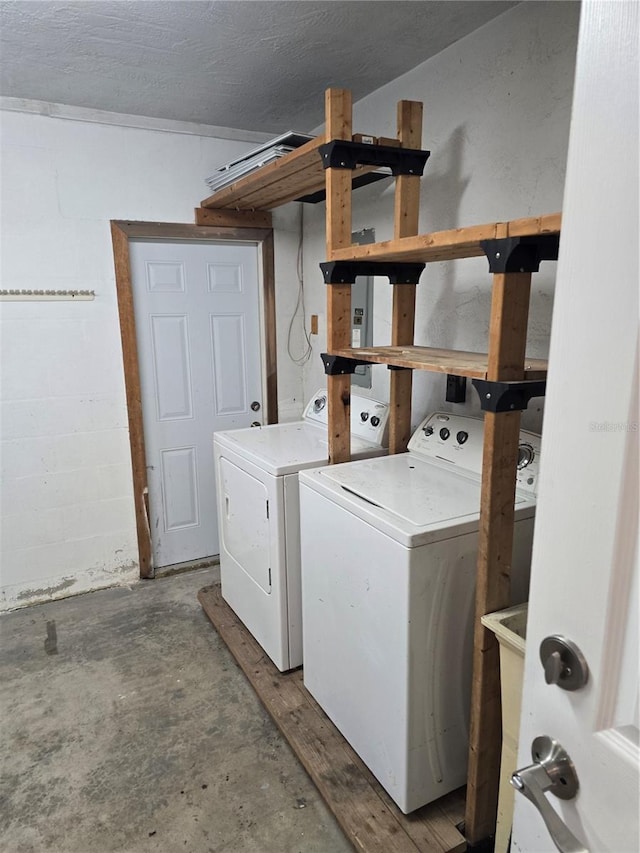 clothes washing area with washer and dryer