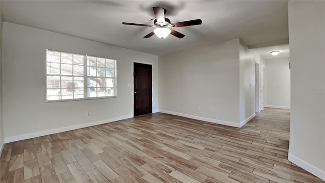 spare room featuring ceiling fan and light wood-type flooring