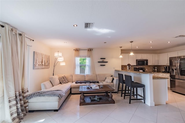 living room featuring light tile patterned floors