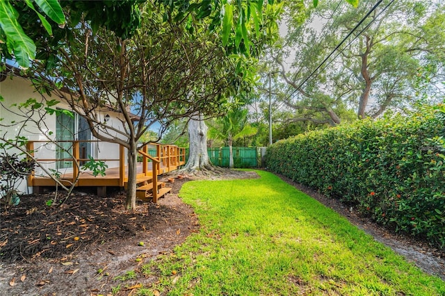 view of yard featuring a wooden deck