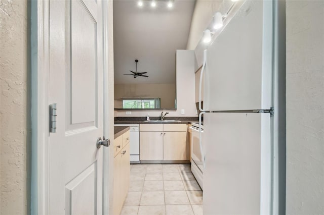 kitchen featuring sink, white appliances, ceiling fan, and light tile patterned flooring