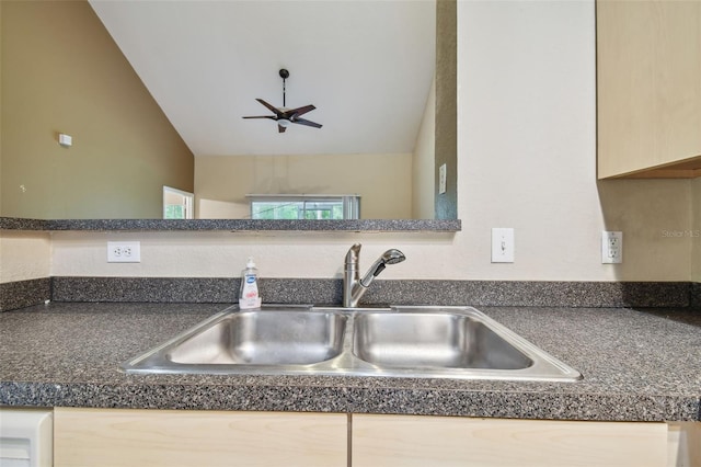 kitchen featuring light brown cabinetry, ceiling fan, sink, and lofted ceiling