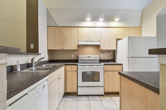 kitchen featuring light brown cabinets, light tile patterned floors, white appliances, and sink