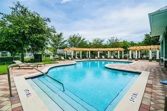 view of swimming pool with a pergola and a patio