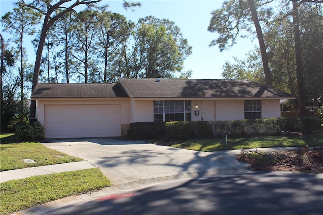 ranch-style house with a front lawn and a garage