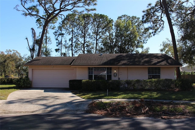 ranch-style house featuring a garage