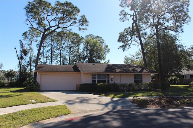 single story home with a garage and a front yard