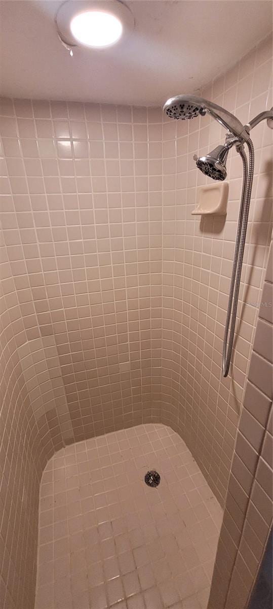 bathroom with a tile shower