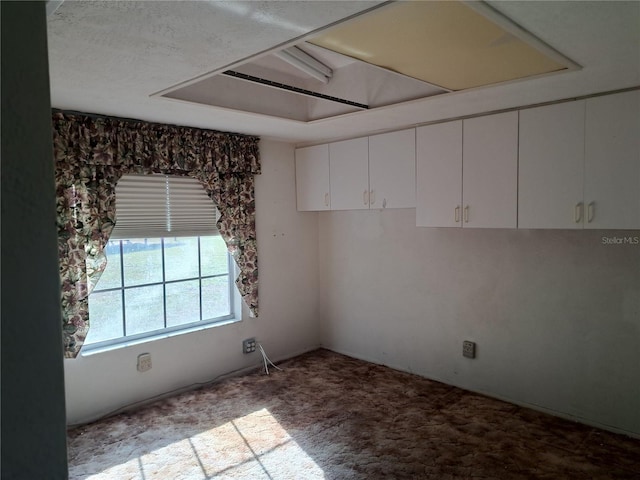 unfurnished room with light colored carpet