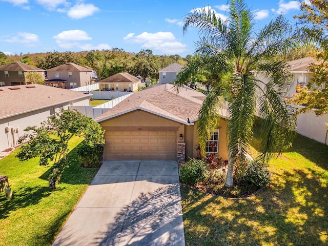 view of front of property with a garage and a front lawn