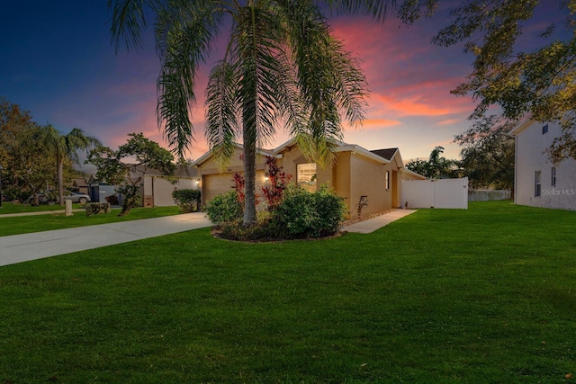 exterior space featuring a yard and a garage