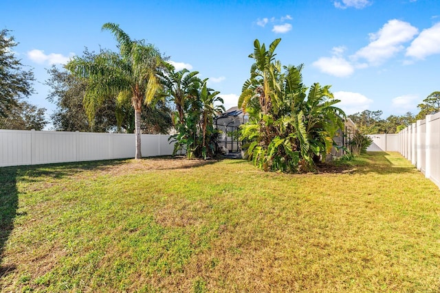 view of yard with a lanai