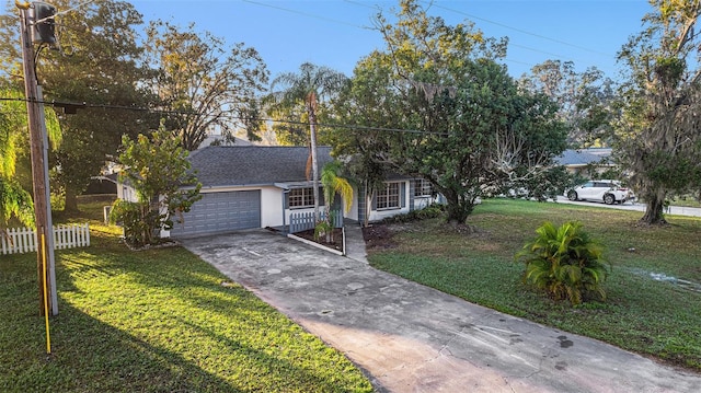 view of front of home featuring a garage and a front lawn