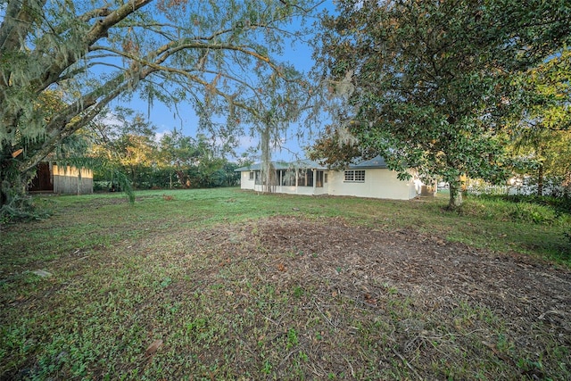 view of yard featuring a sunroom