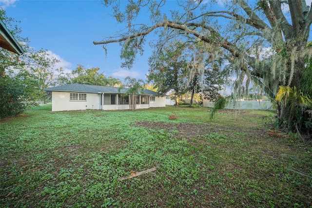 view of yard with a sunroom