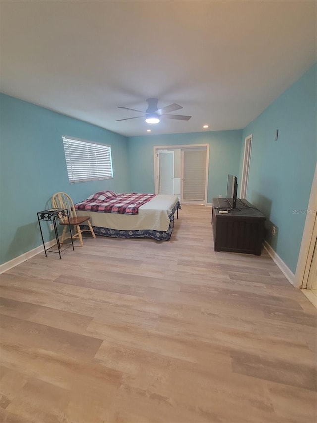 bedroom featuring ceiling fan and light wood-type flooring