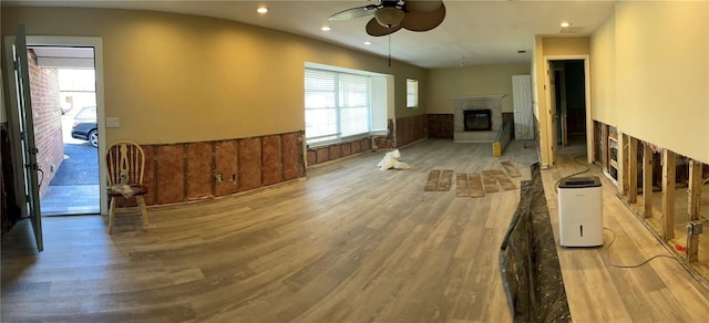 living room with ceiling fan and light hardwood / wood-style floors