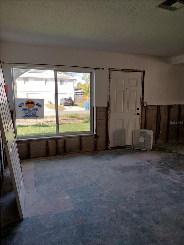 empty room with a textured ceiling