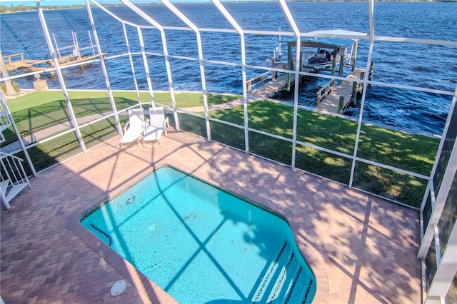 view of swimming pool with a boat dock, a water view, and a patio