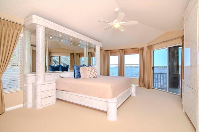 carpeted bedroom with a water view, vaulted ceiling, and ceiling fan