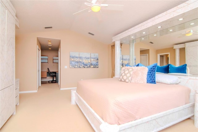 bedroom with ceiling fan, light colored carpet, and vaulted ceiling