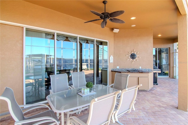 view of patio / terrace featuring ceiling fan