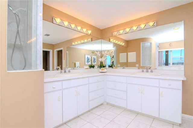 bathroom with tile patterned flooring and vanity